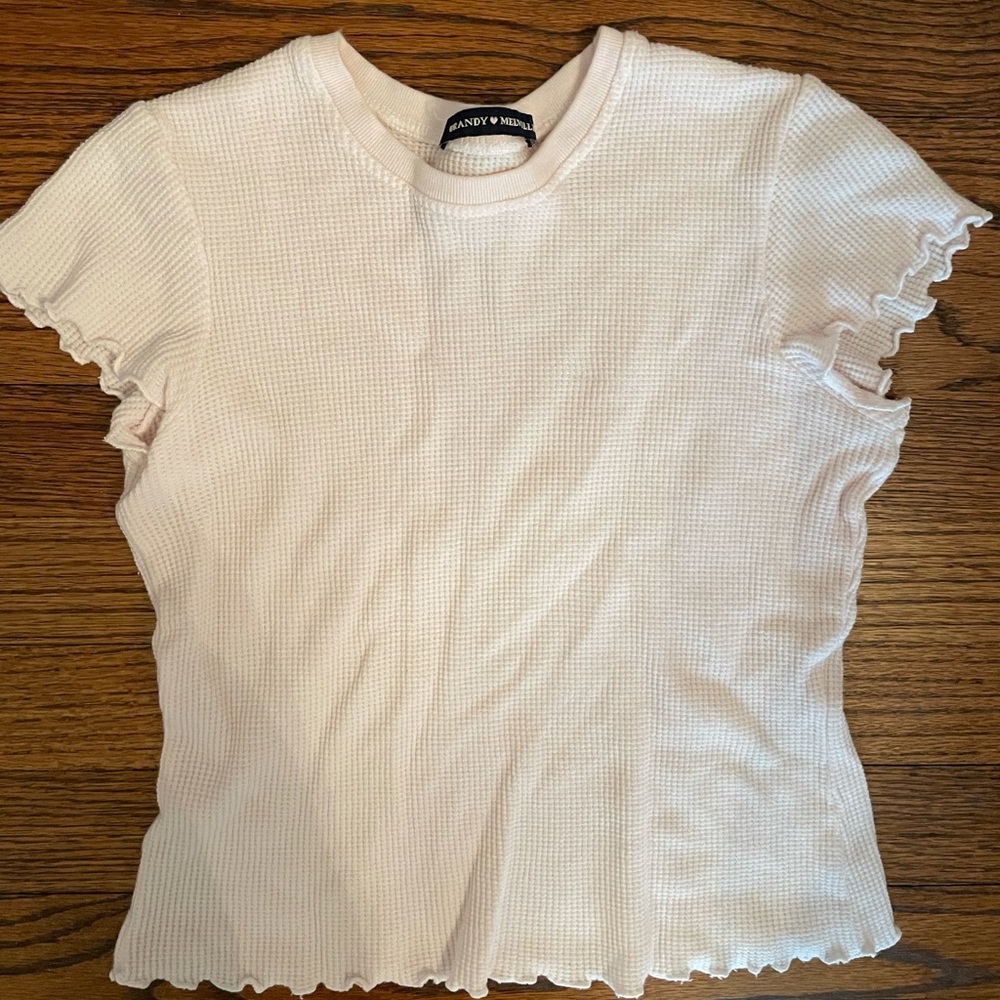 pink ruffled t shirt